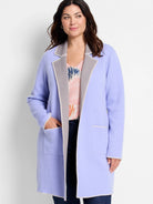 Lavender reversible knit jacket with gray interior and cream contrast stitching, open front, and patch pockets.