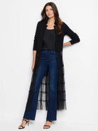 Black knit jacket. Cropped, open front with a stand collar and V-split neckline.