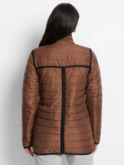Brown puffer jacket with horizontal quilting. Features black trim across the back, cuffs, and hem.