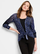 Indigo and white dashed knit cardigan, tied at the front.