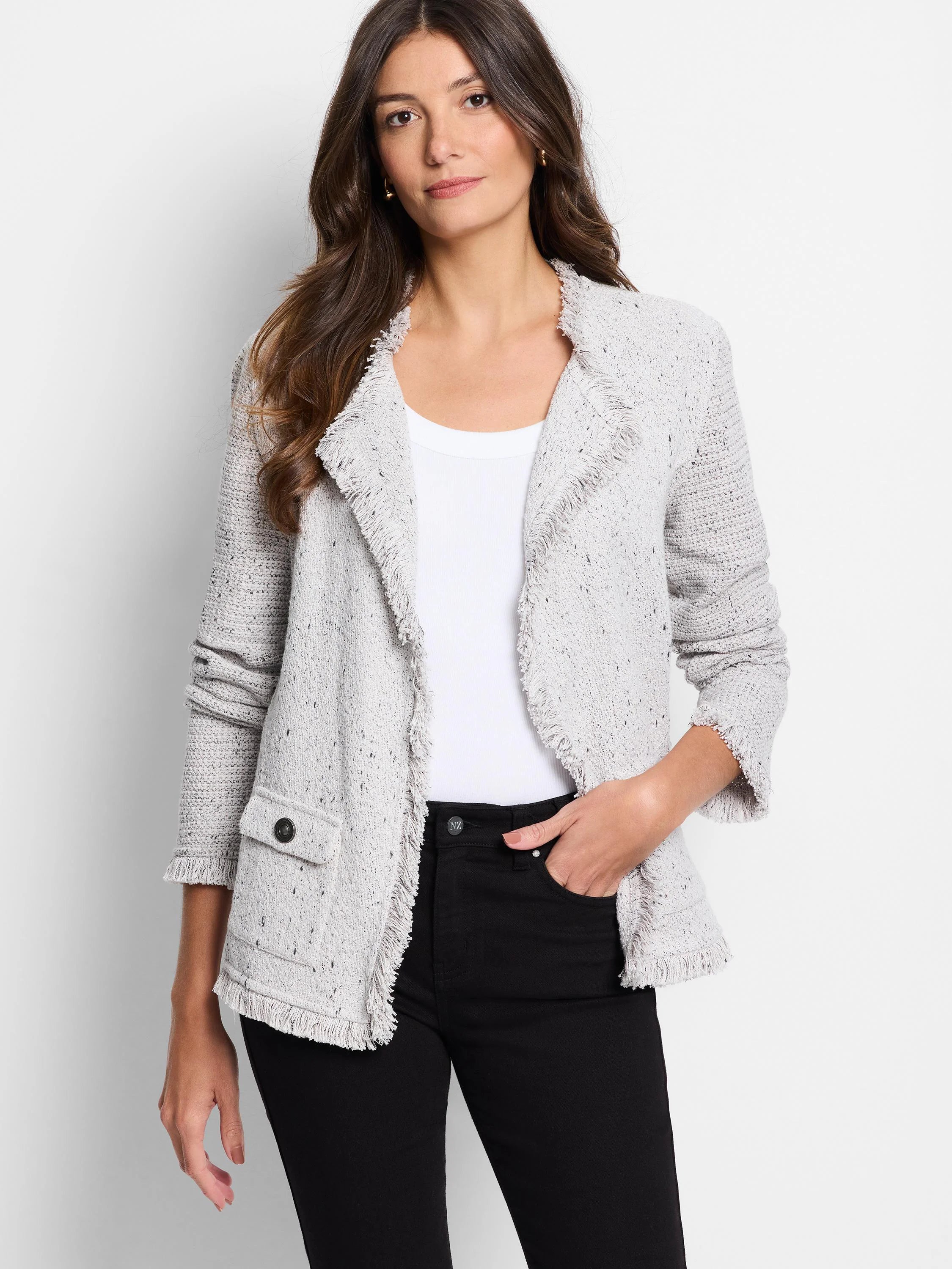 Light grey flecked knit jacket with fringe on edges, 3/4 sleeves, and a patch pocket with a dark button.