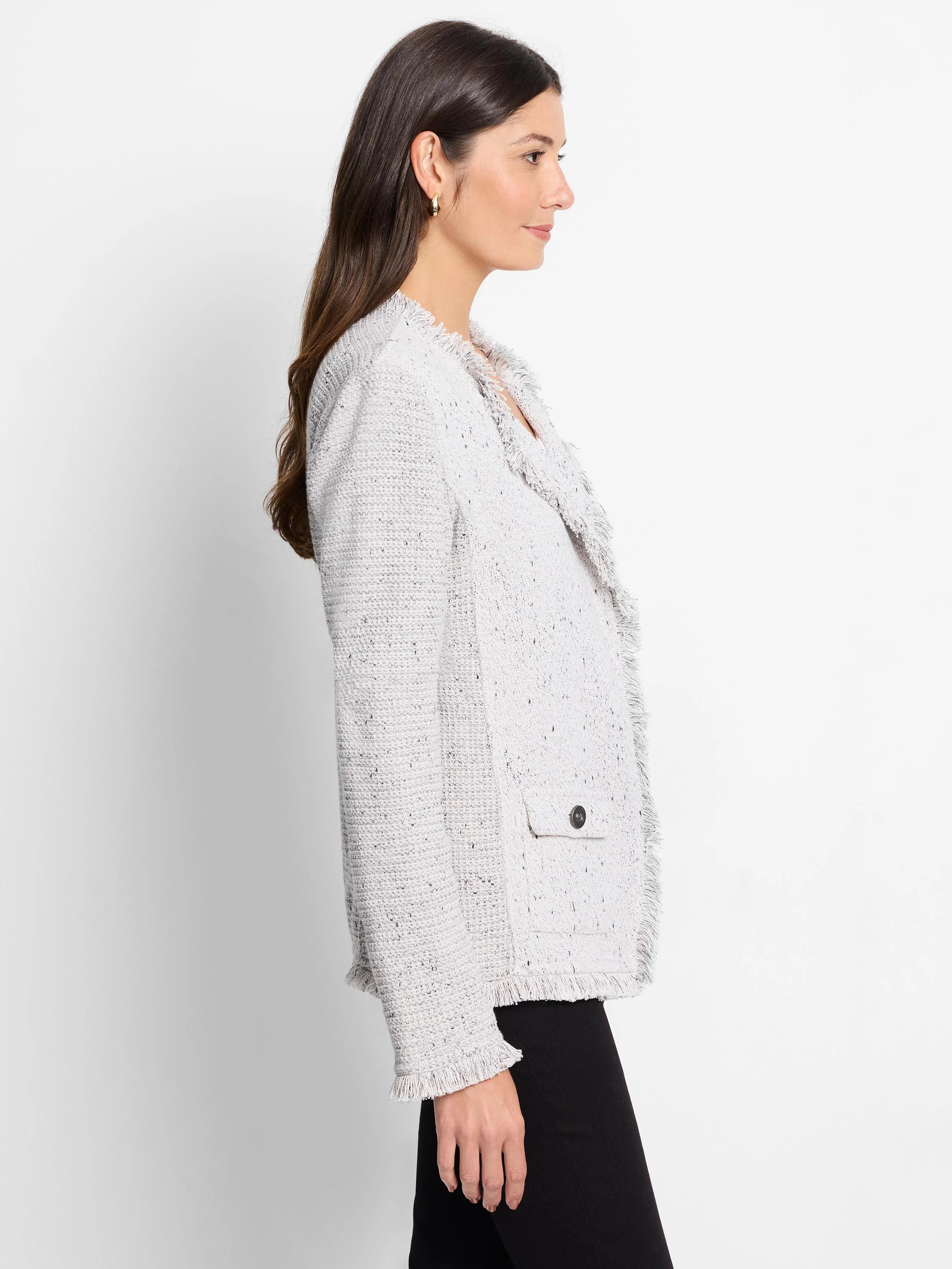 Light grey speckled knit jacket with fringe trim on lapels, cuffs, and hem. Features a buttoned patch pocket.