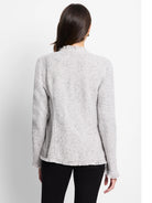 Model from back in light gray textured jacket with dark flecks. Fringe trim at cuffs and hem.