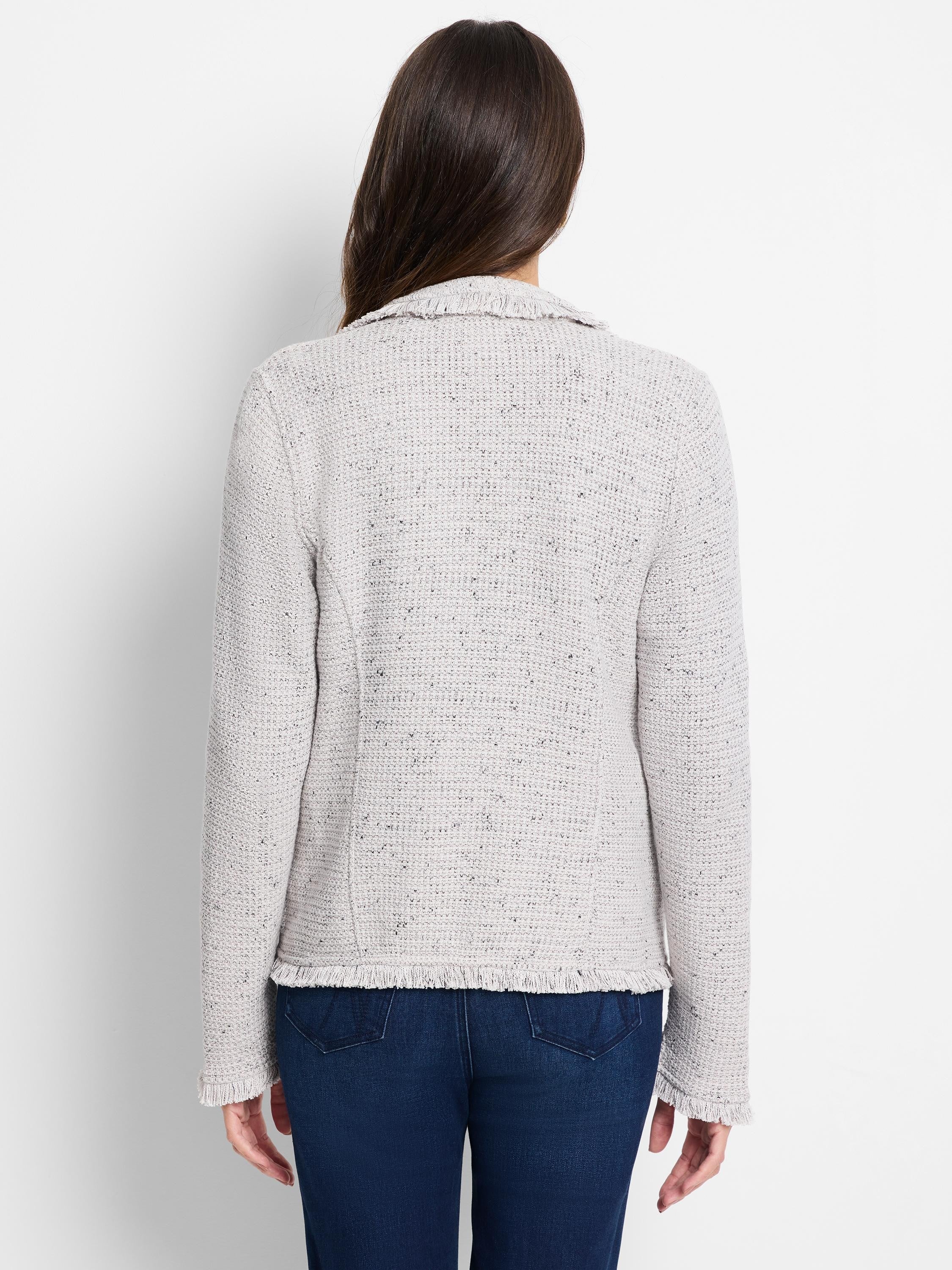 Back of light grey tweed-style knit jacket with collar and fringe trim on hem and cuffs.