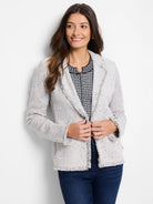 Light grey mixed knit jacket with dark flecks, featuring a collared design and fringe details on edges and cuffs.