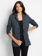 Speckled dark gray knit blazer with lapels, three dark buttons, three decorative gold-tone buttons, and two flap pockets.