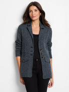 Dark grey marl knit blazer. Lapels, 3 black buttons on left, 3 gold-rimmed buttons on right, 2 buttoned flap pockets.