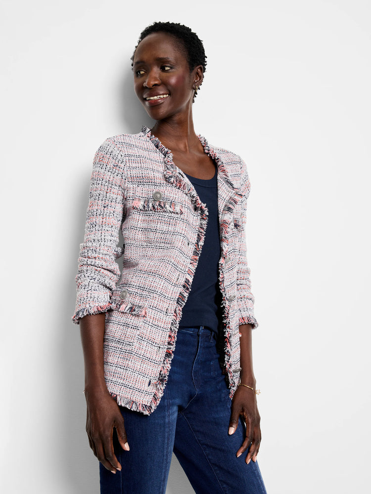 Pink, white, and navy tweed knit jacket with fringe trim on collar, front, pockets, and cuffs, and metallic buttons.