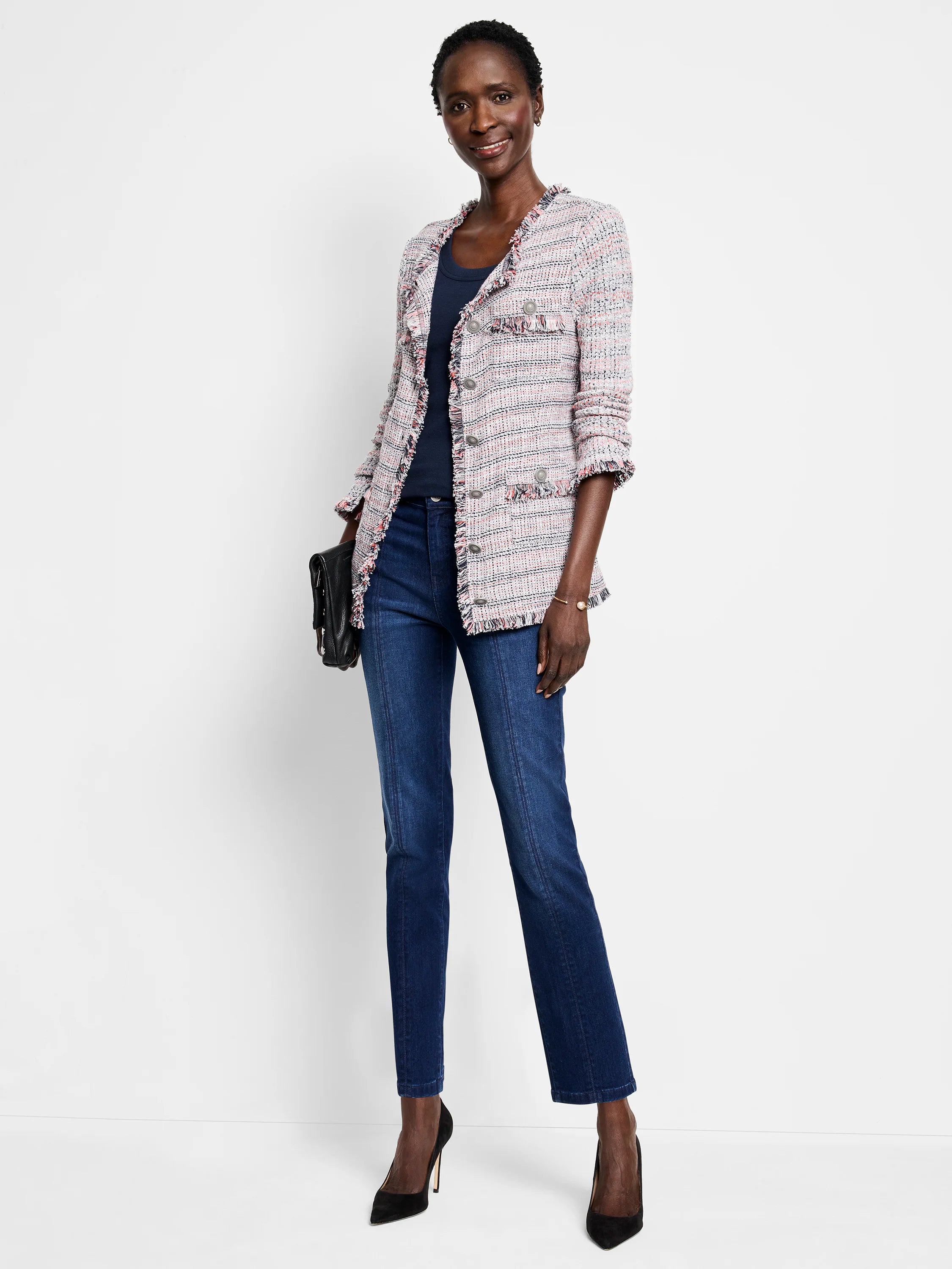 Pink, white, and navy plaid knit jacket with fringe trim on all edges, cuffs, and buttoned pockets.