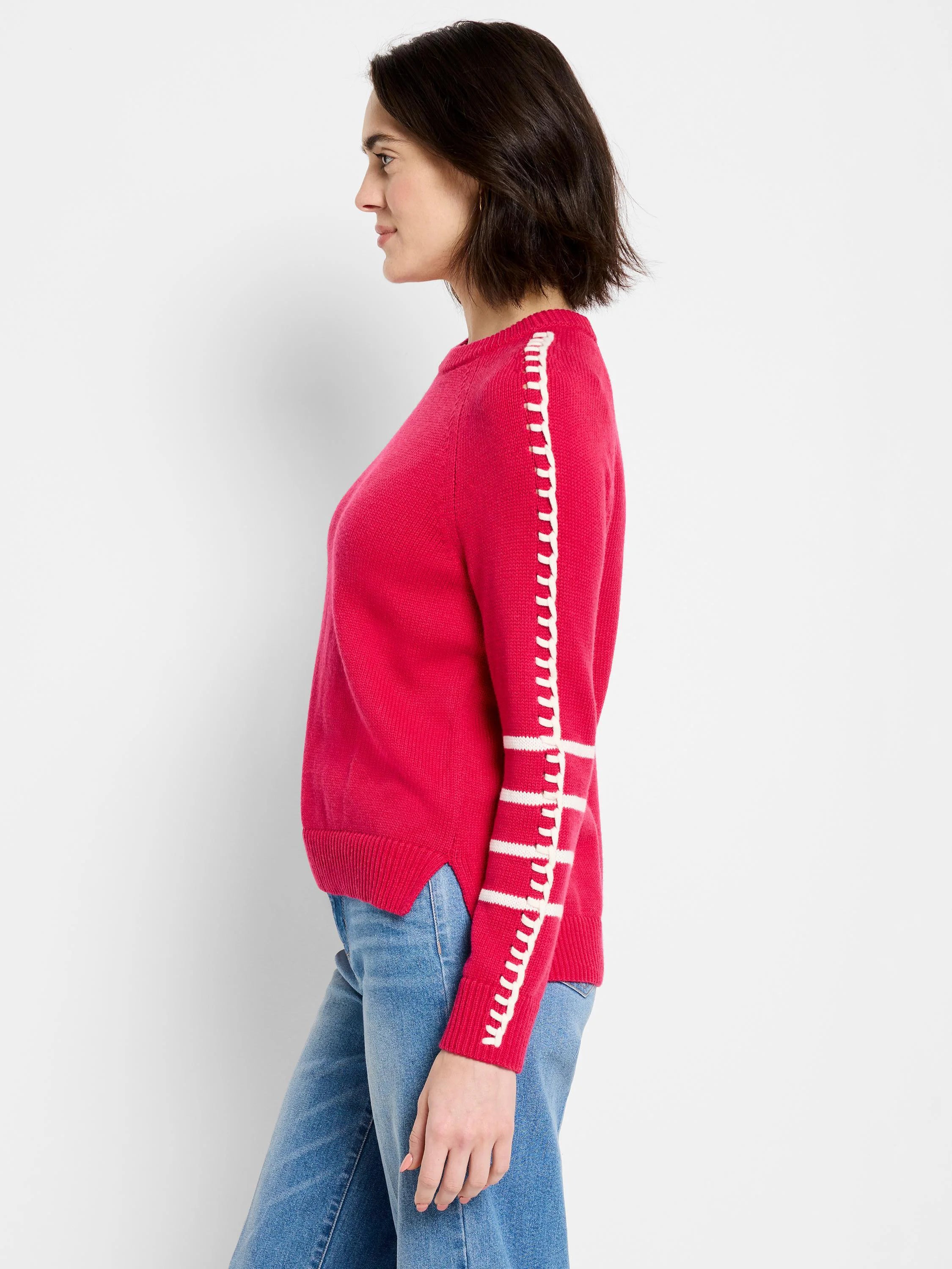 Bright pink sweater with white decorative stitched bands on the sleeves.