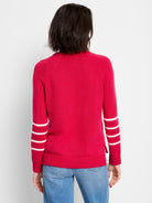 Bright red crewneck sweater with three white horizontal stripes on each raglan sleeve.