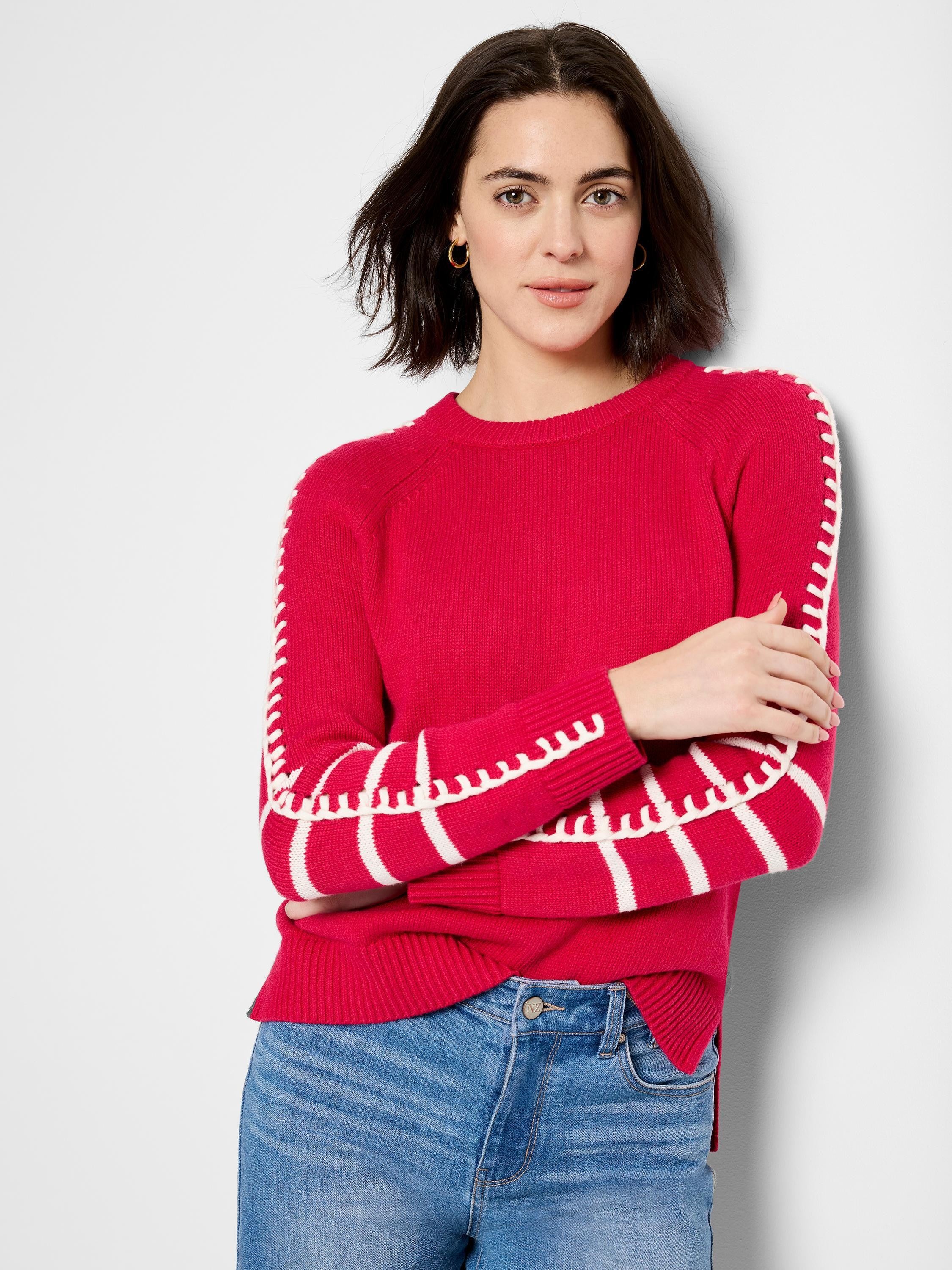 Bright red crew neck sweater with white dash stitching along raglan seams and sleeves.