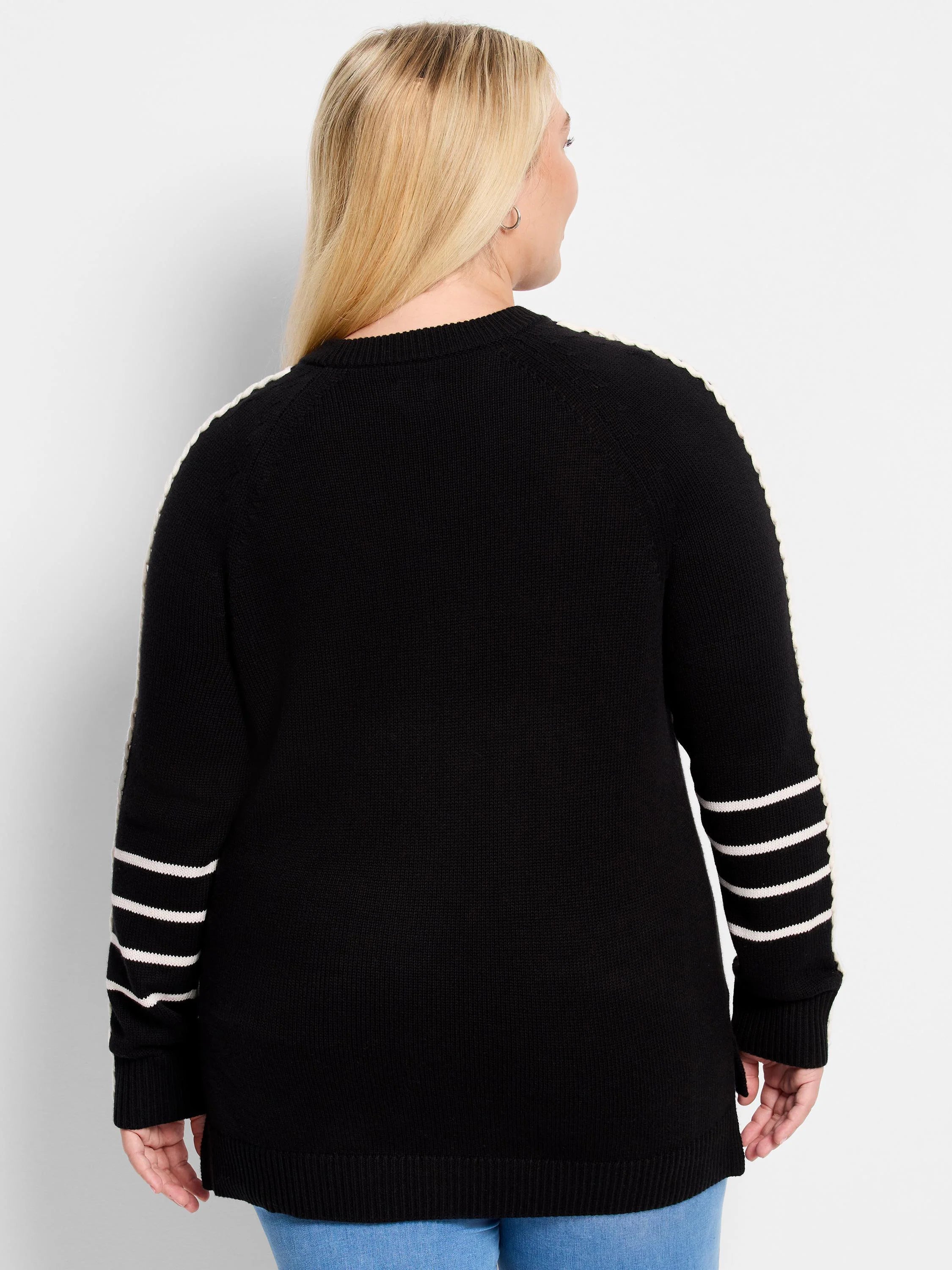 Black sweater with a white stripe along each outer arm and three white stripes on each forearm.