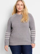 Grey ribbed crewneck sweater with white stitching along shoulder seams and three white stripes on lower sleeves.