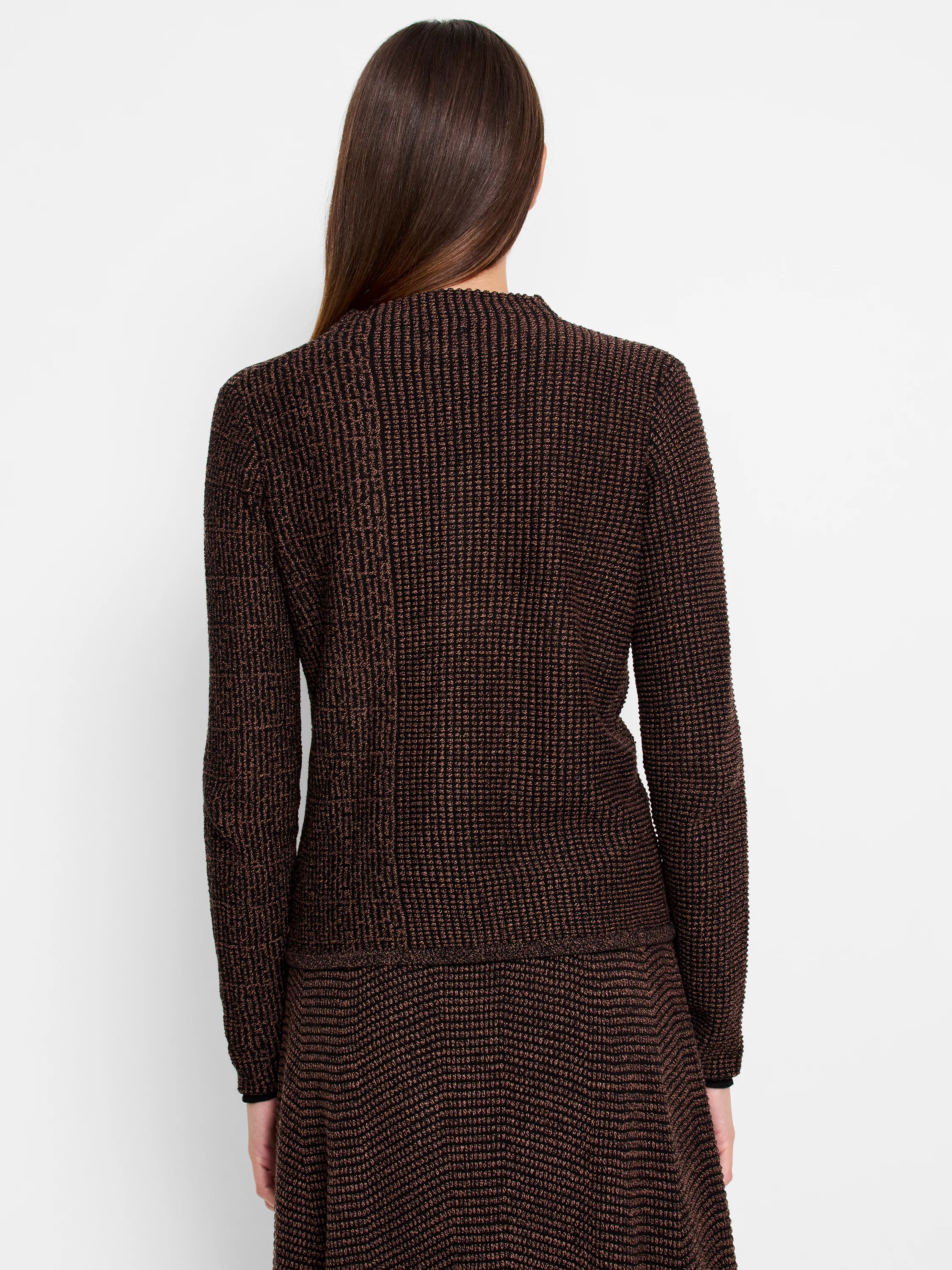 Brown and black knit sweater with a textured pattern. Long sleeves and a crew neck.