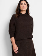 Brown mock neck sweater with a textured, waffle-knit pattern.  Slight metallic sheen.