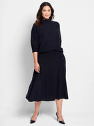 Dark navy blue, textured knit sweater and midi skirt set.  High mock neck on sweater. A-line skirt.