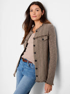 Brown and black mixed knit jacket with herringbone pattern. Features fringe trim, button front, and chest pockets.