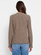 Beige and dark brown mixed knit jacket, collarless, with fringe trim on hem and cuffs, viewed from back.
