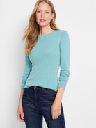 Light teal ribbed knit sweater tee with long sleeves and a round neckline.