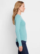 Pale teal ribbed long-sleeve tee.  Close-fitting, crew neck.