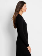 Black ribbed sweater tee with pleated hem; long sleeves.