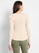 Off-white ribbed, long-sleeved fitted sweater tee.  Back view.