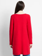 Red jacket, beige collar and cuffs.  Long sleeves.  Reverse side not shown.