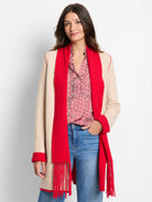 Beige and red reversible jacket. Red side features long fringe.  Red trim details.
