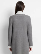 Gray long-sleeve jacket, off-white inner cuffs.  Reverse side not shown.