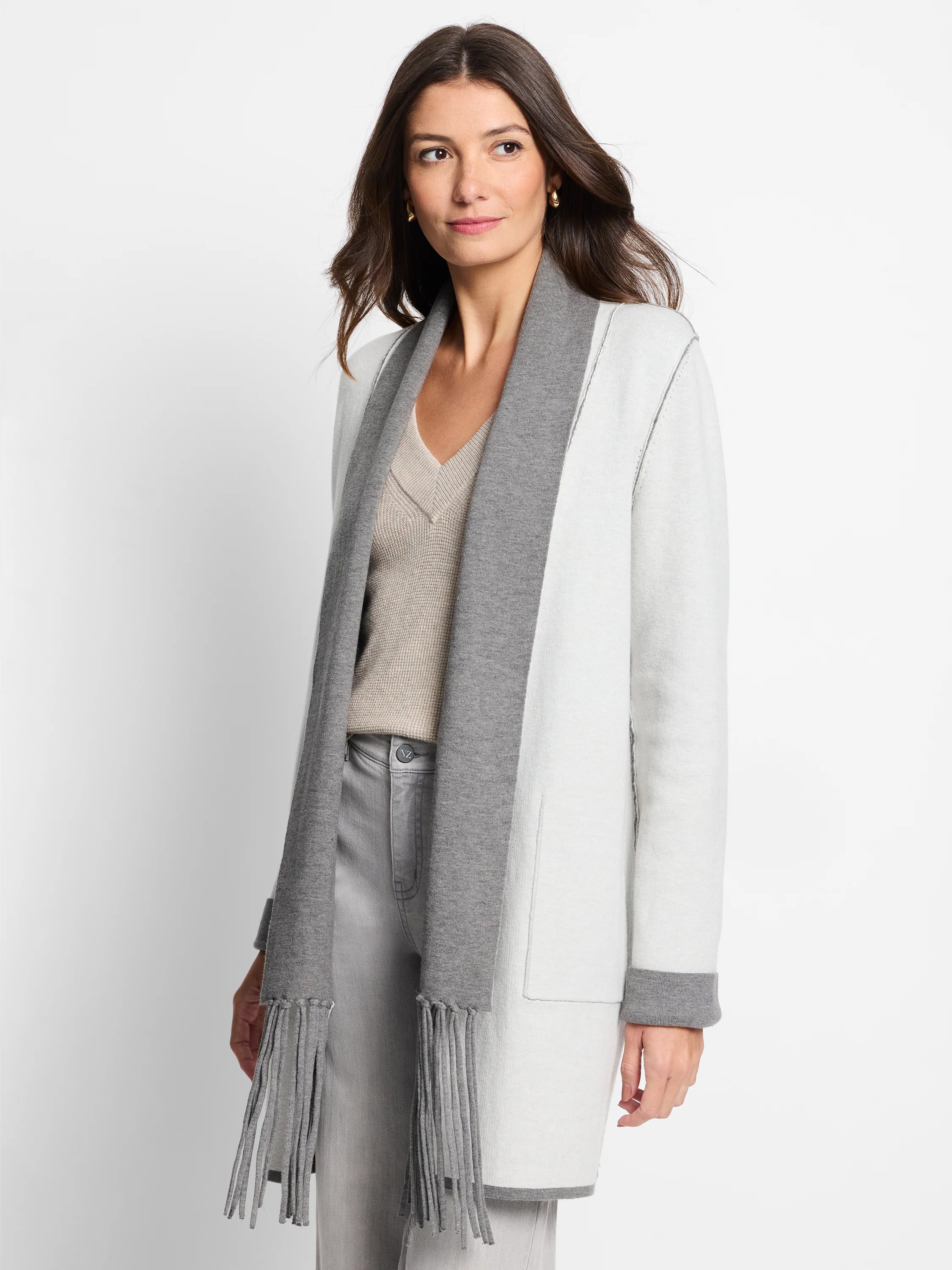 Off-white jacket with grey collar, cuffs, and long fringe scarf.  Reversible.