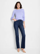 Lavender crewneck sweater with subtle puffed shoulders and long sleeves.