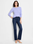 Lavender crew neck sweater with long, slightly puffed sleeves, and ribbed cuffs and hem.