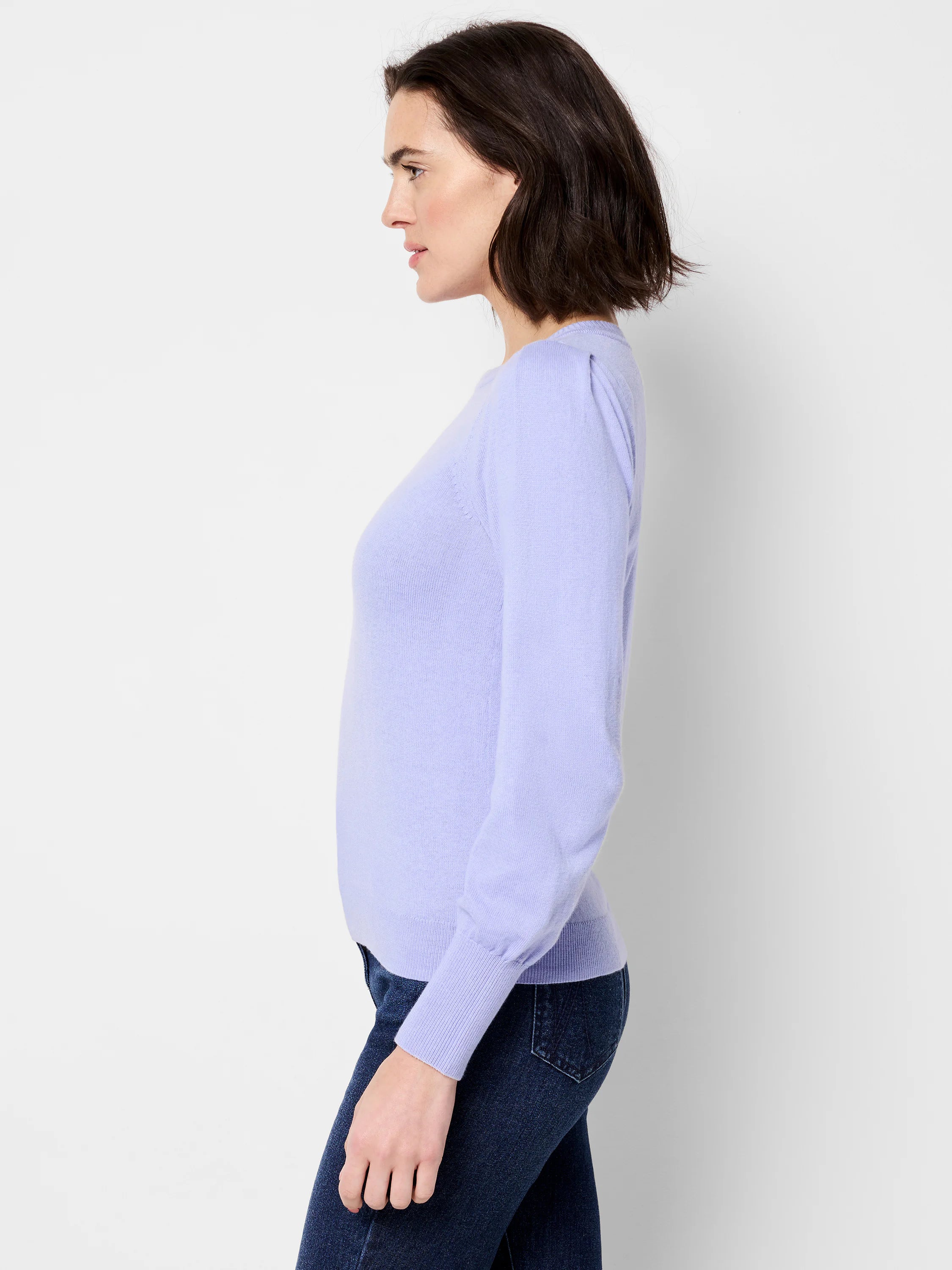 Lavender long-sleeve sweater with slight puff shoulders.