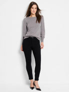 Grey crewneck sweater with long sleeves, ribbed cuffs, and hem.