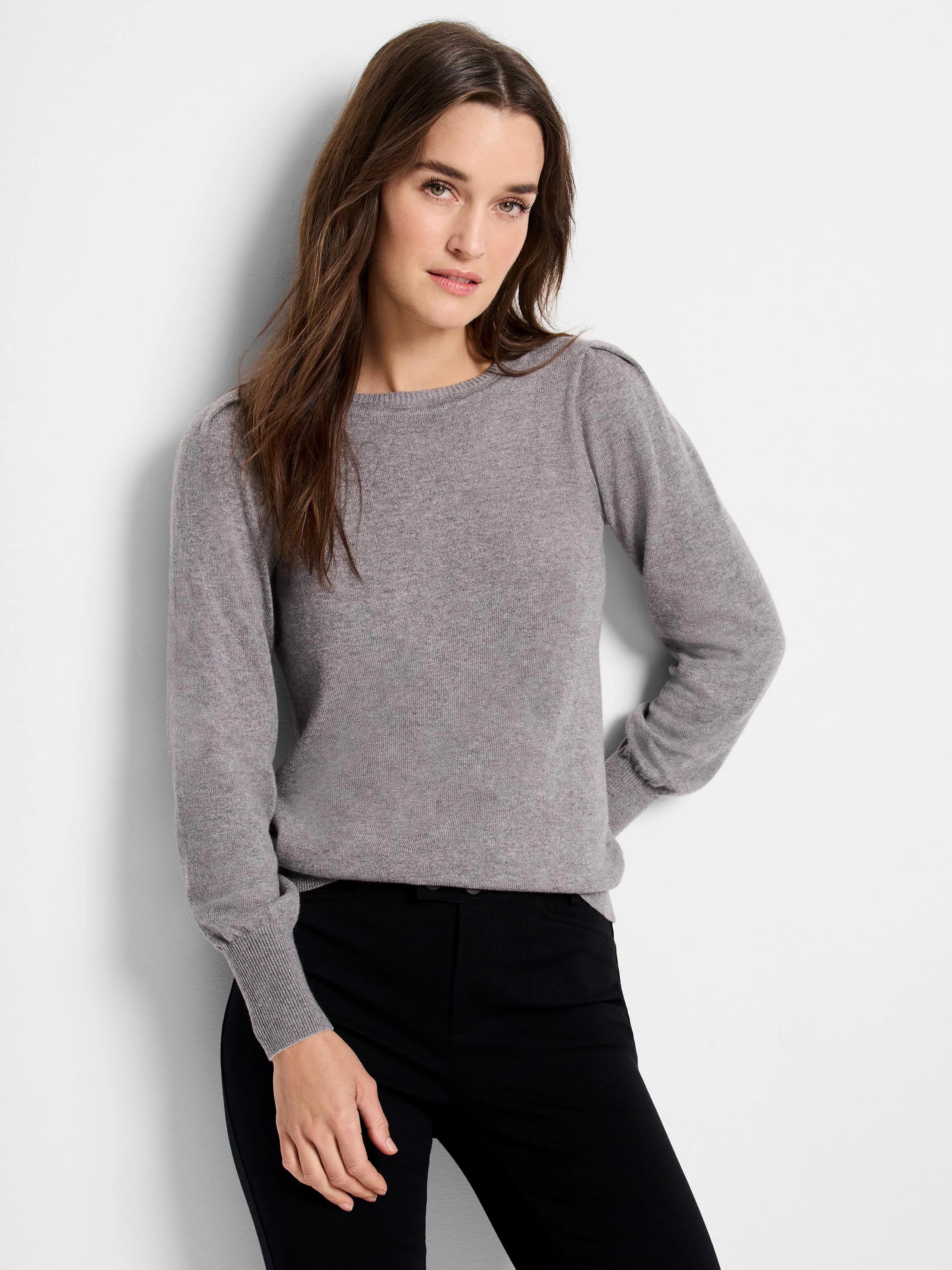Light gray round-neck sweater with subtle shoulder gathers, long sleeves, and ribbed cuffs/hem.