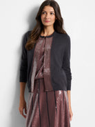 Dark gray cardigan with mauve sequin trim down the front.