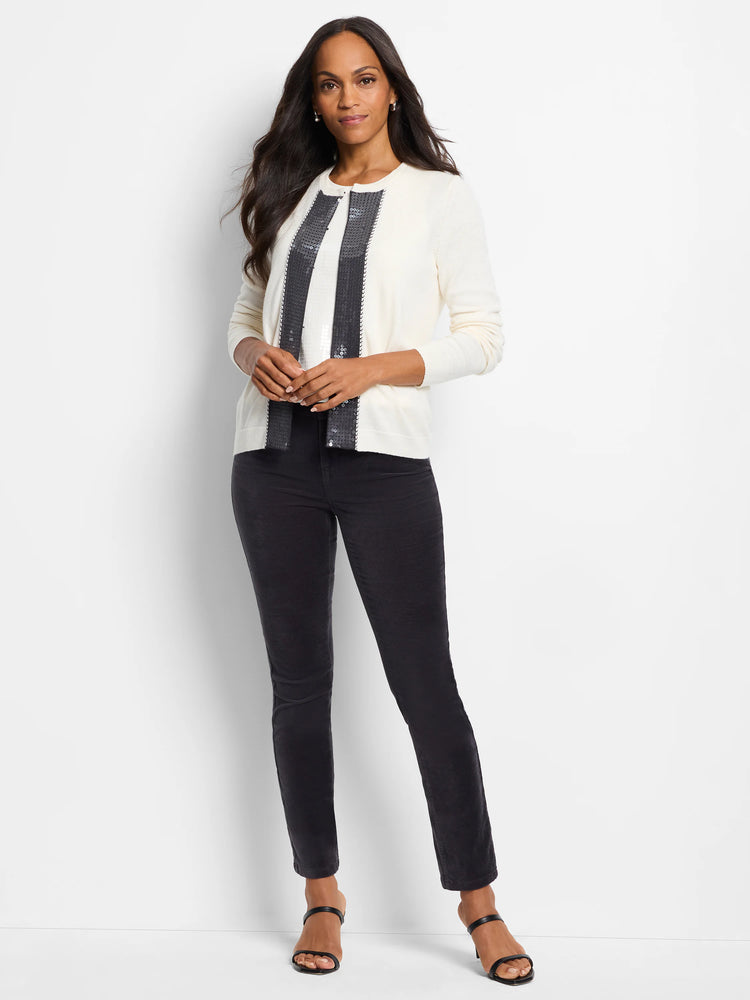Cream cardigan with black sequin trim along the front opening.