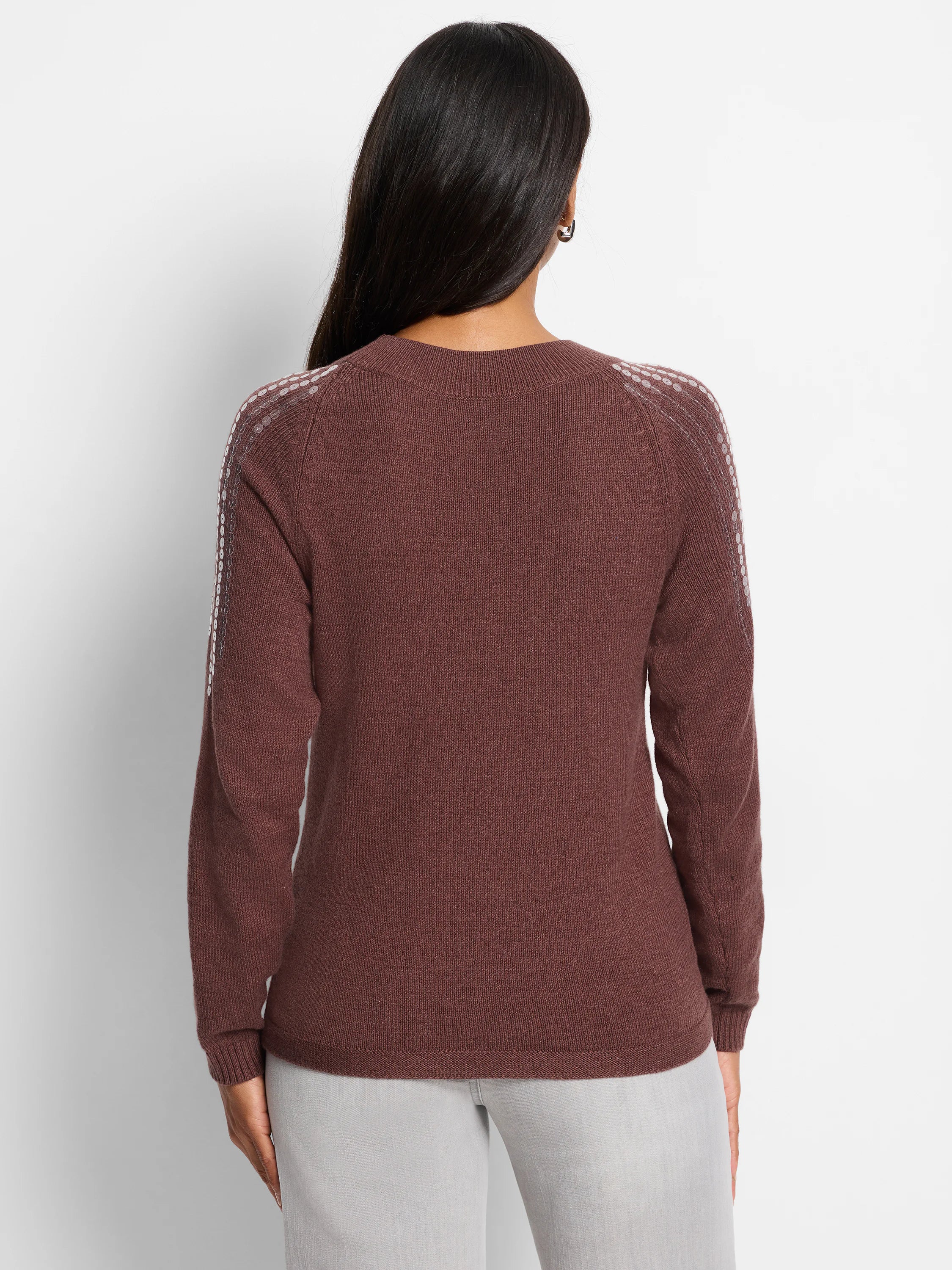 Brown sweater, long sleeves, subtle lighter-toned sequins on shoulder seams.