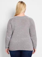 Here's alt text that meets the requirements:

Gray sweater, raglan sleeves with lighter gray detailing.