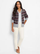 Black cardigan with zigzag pattern in pink, red, & beige.  Gray sleeves and hem. Button front.