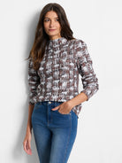 Brown, white, and gray waffle-knit sweater. Mock neck, long sleeves, abstract pattern.