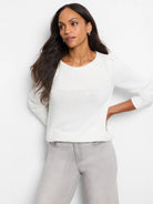 Off-white sweater with light gray sequins across the shoulders and neckline.  Three-quarter sleeves.