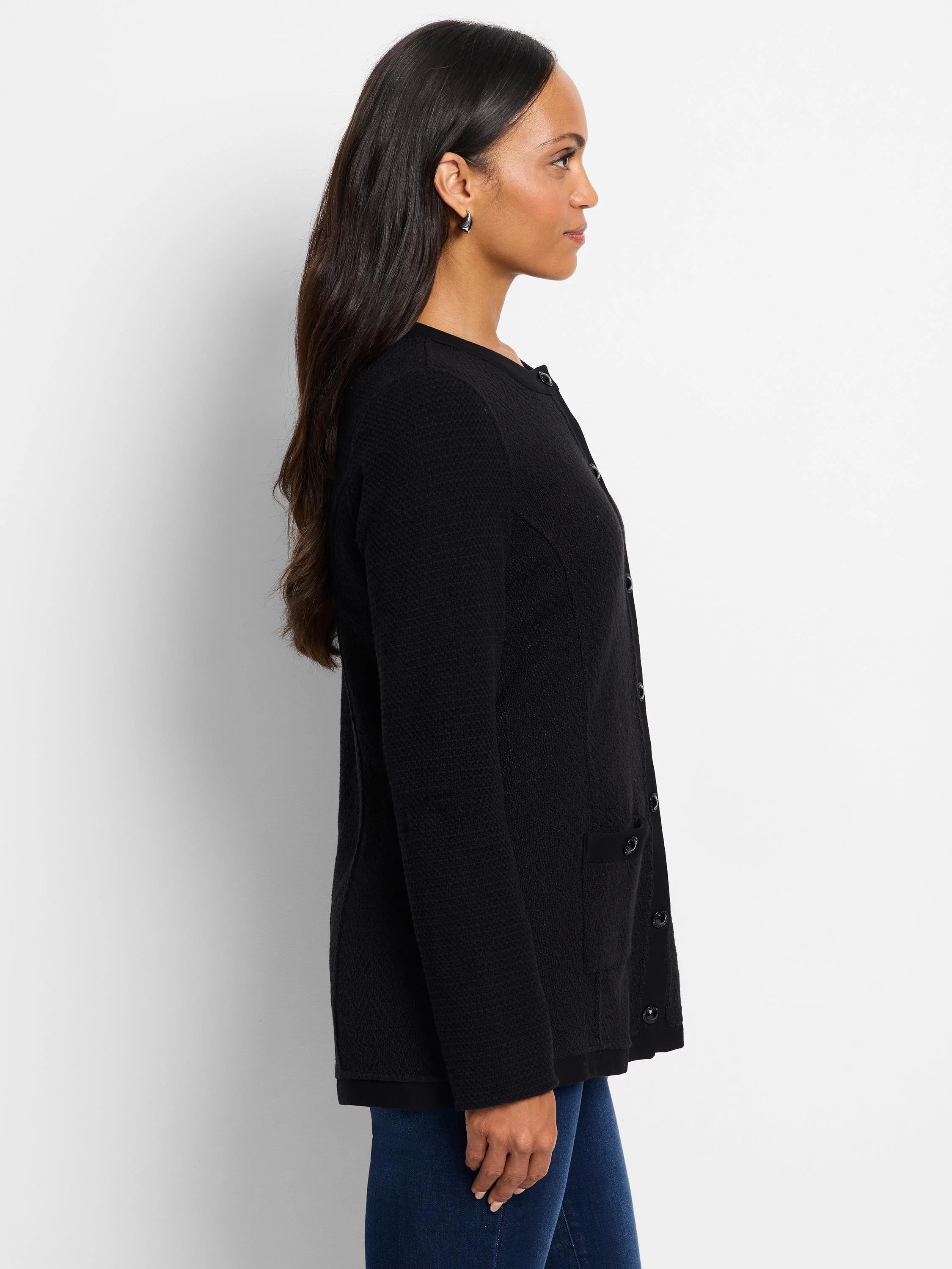 Black knit jacket, button front, textured fabric, small pockets.
