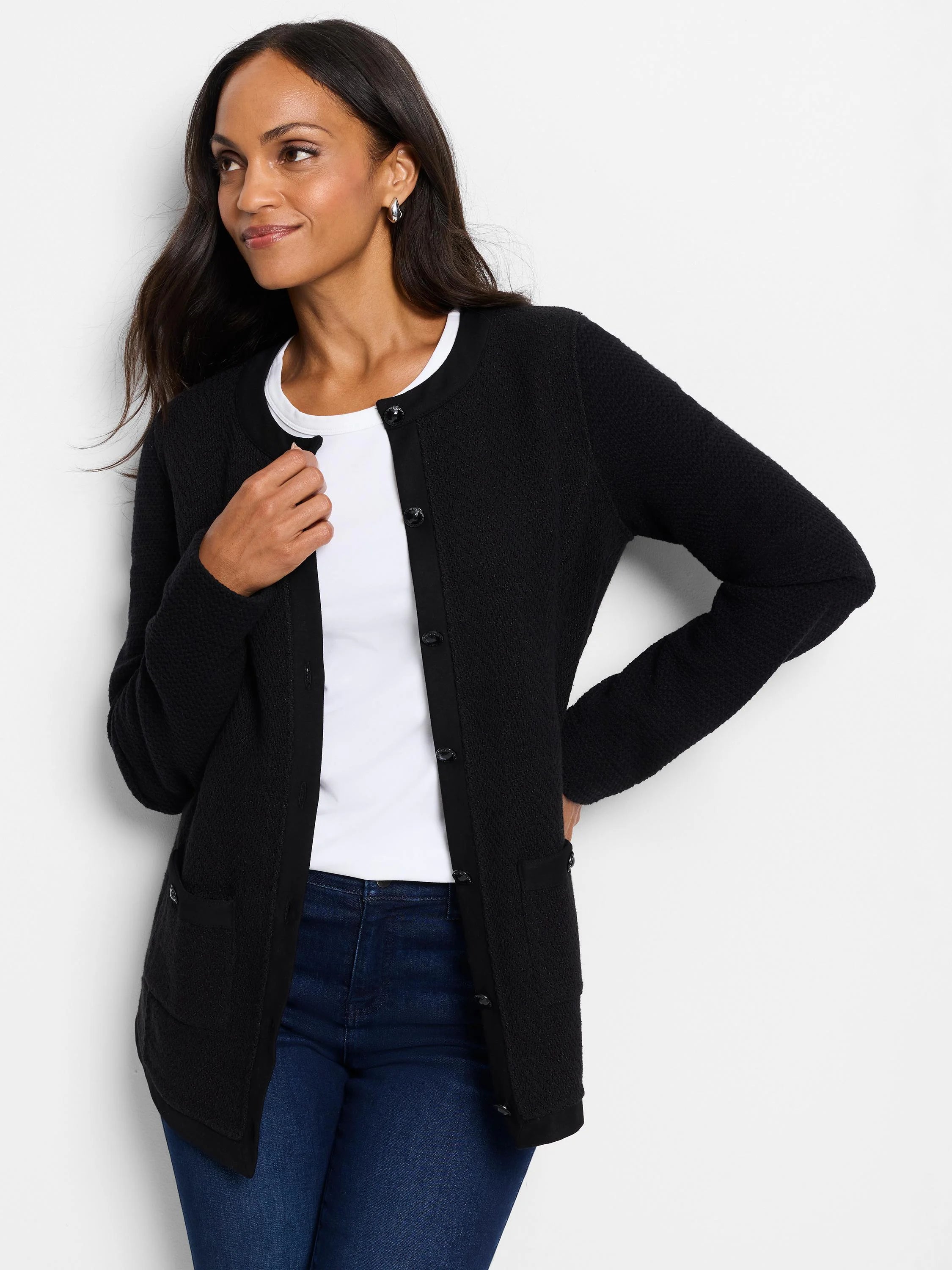 Black knit button jacket, textured fabric,  black buttons, and patch pockets.