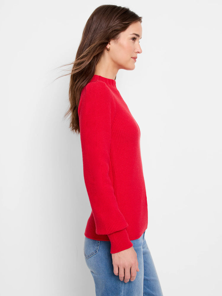 Red waffle-knit sweater, long sleeves, mock neck.