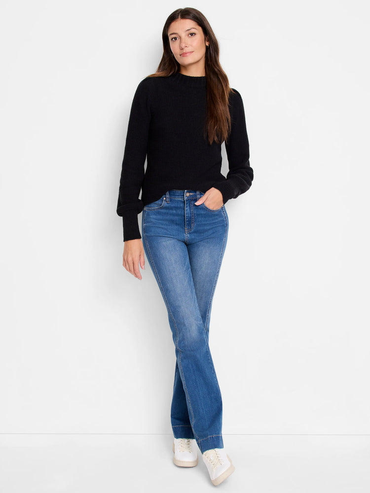 Black waffle-knit sweater, long sleeves, mock neck.