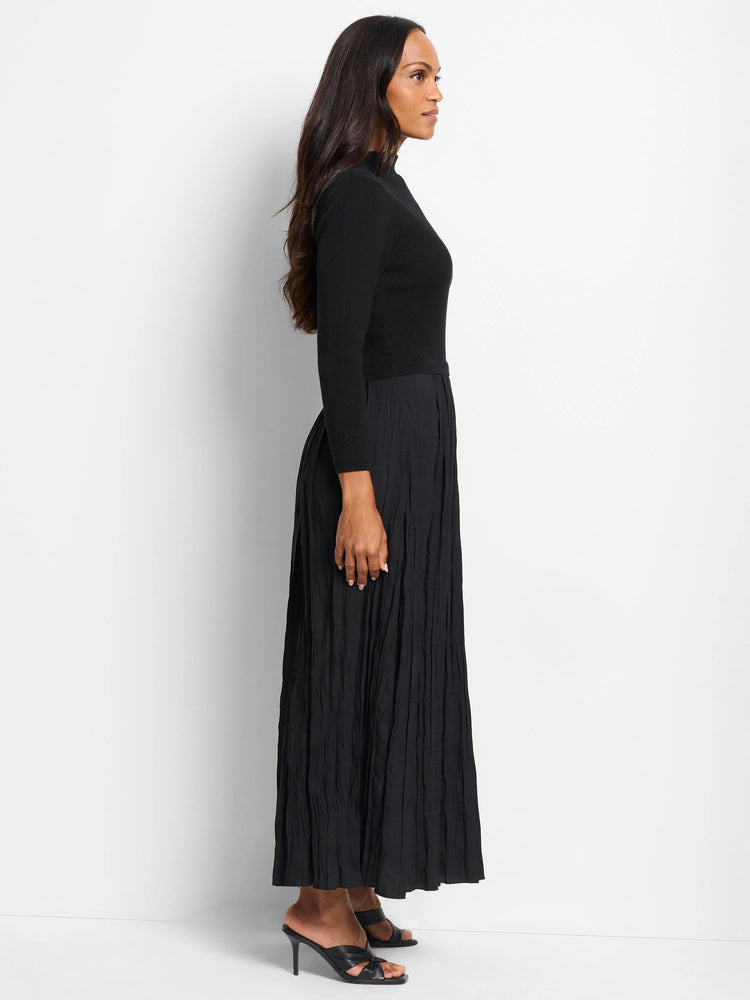 Black maxi dress. Fitted ribbed knit top, pleated skirt.  Long sleeves, mock neck.