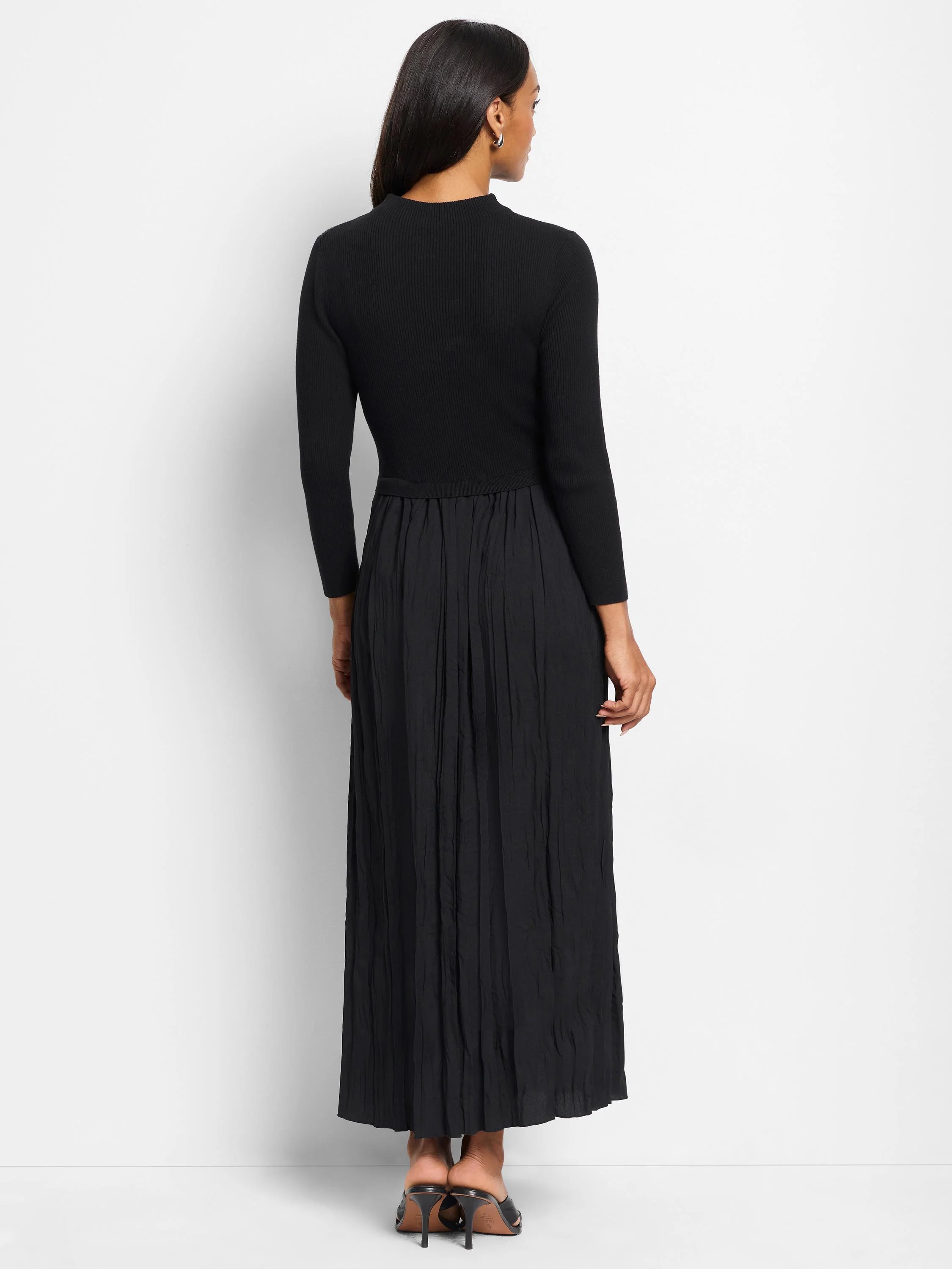 Black ribbed knit top and pleated maxi skirt.  Three-quarter sleeves.