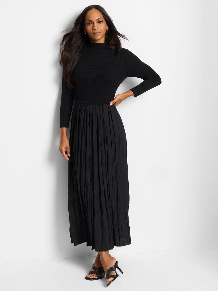 Black midi dress. Ribbed mock neck top and pleated skirt.  Three-quarter sleeves.
